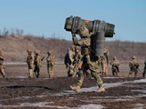 DONETSK: A Ukrainian serviceman carries an anti-tank weapon during an exercise in the Donetsk region of eastern Ukraine on February 15 (Vadim Ghirda/AP)